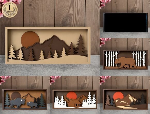 Layered wooden landscape art featuring mountains, forests, and wildlife scenes