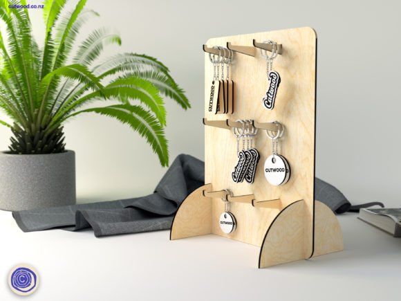 Laser cut wooden keychain display stand for organizing and showcasing handmade keychains at craft fairs.