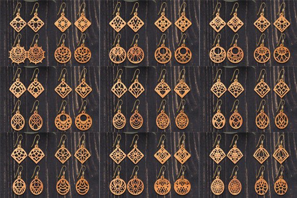 Collection of wooden laser cut earrings featuring different decorative shapes and patterns